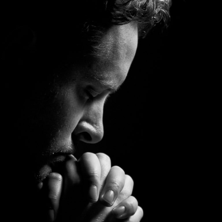 praying intently / the man communes with his God / desperate for his love